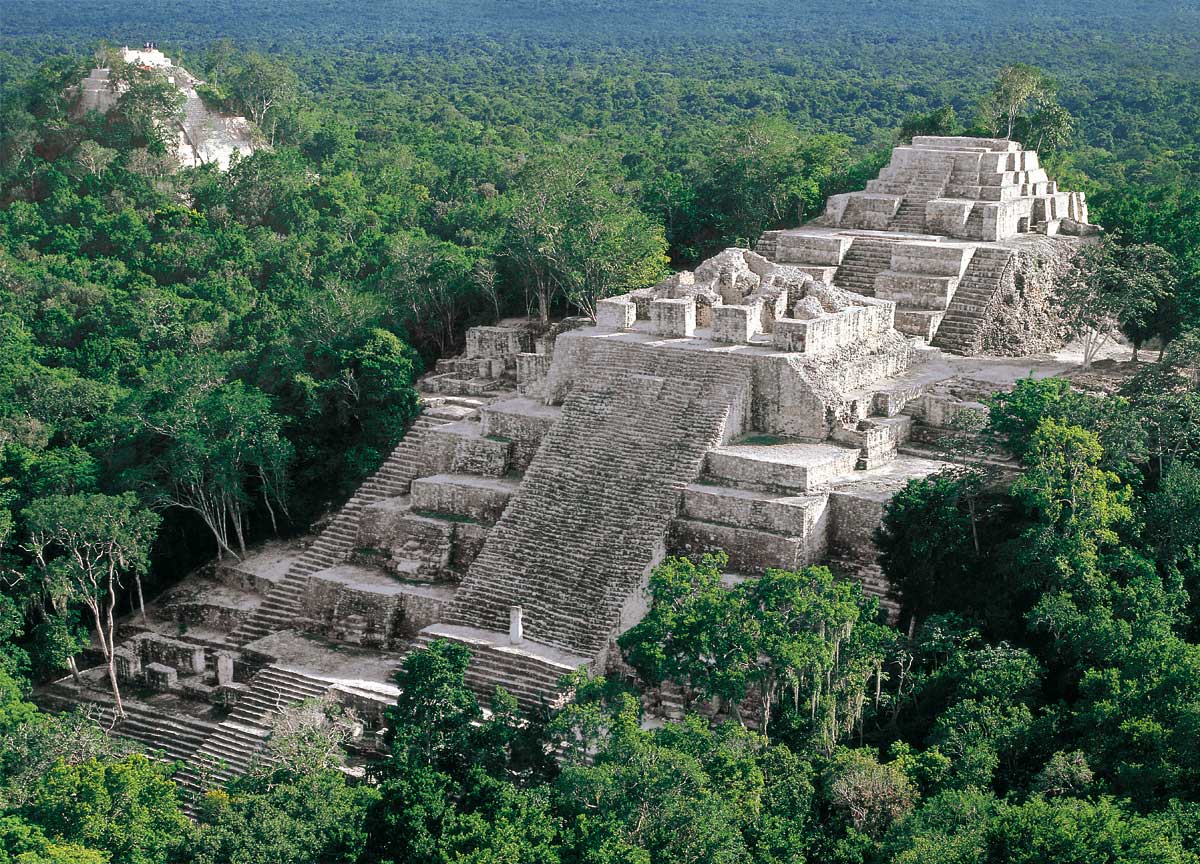 Calakmul archaeological site, an expansive Mayan city surrounded by lush rainforest 